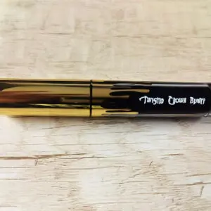 Gold and black mascara tube