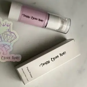 Cosmetic bottle and box on marble surface