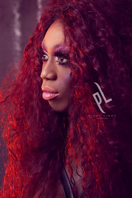 Individual with long, voluminous red hair