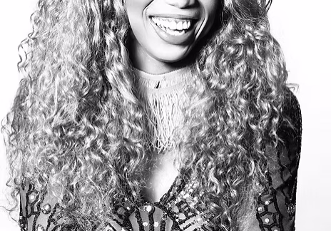 Woman laughing in beaded dress